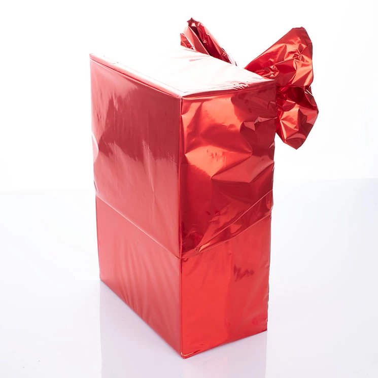 Ajándékcsomagolás piros nagy masnival