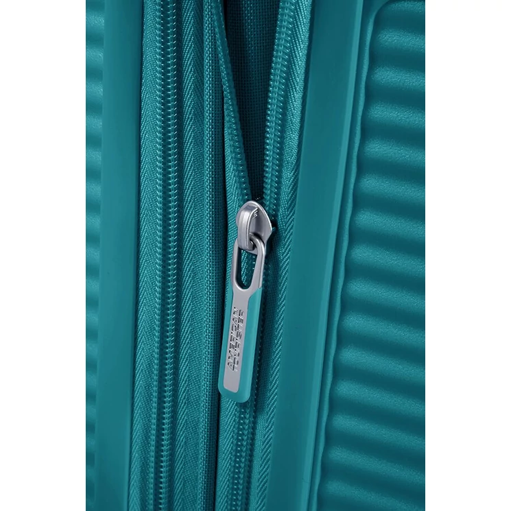American Tourister Soundbox bővíthető Spinner bőrönd 55 fűzöld színben