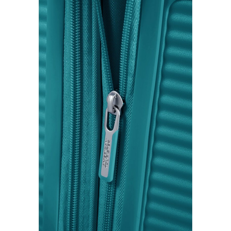 American Tourister Soundbox bővíthető Spinner bőrönd 55 fűzöld színben