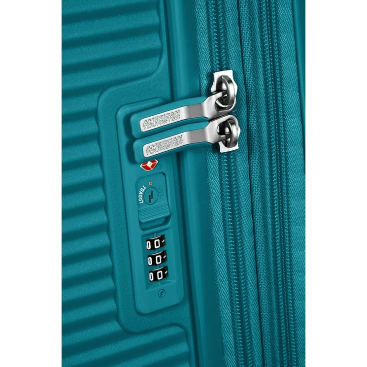 American Tourister Soundbox bővíthető Spinner bőrönd 55 fűzöld színben