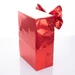 Ajándékcsomagolás piros nagy masnival